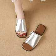 Margolaine Dubreuil | Black Faux Leather Flat Slide Sandals