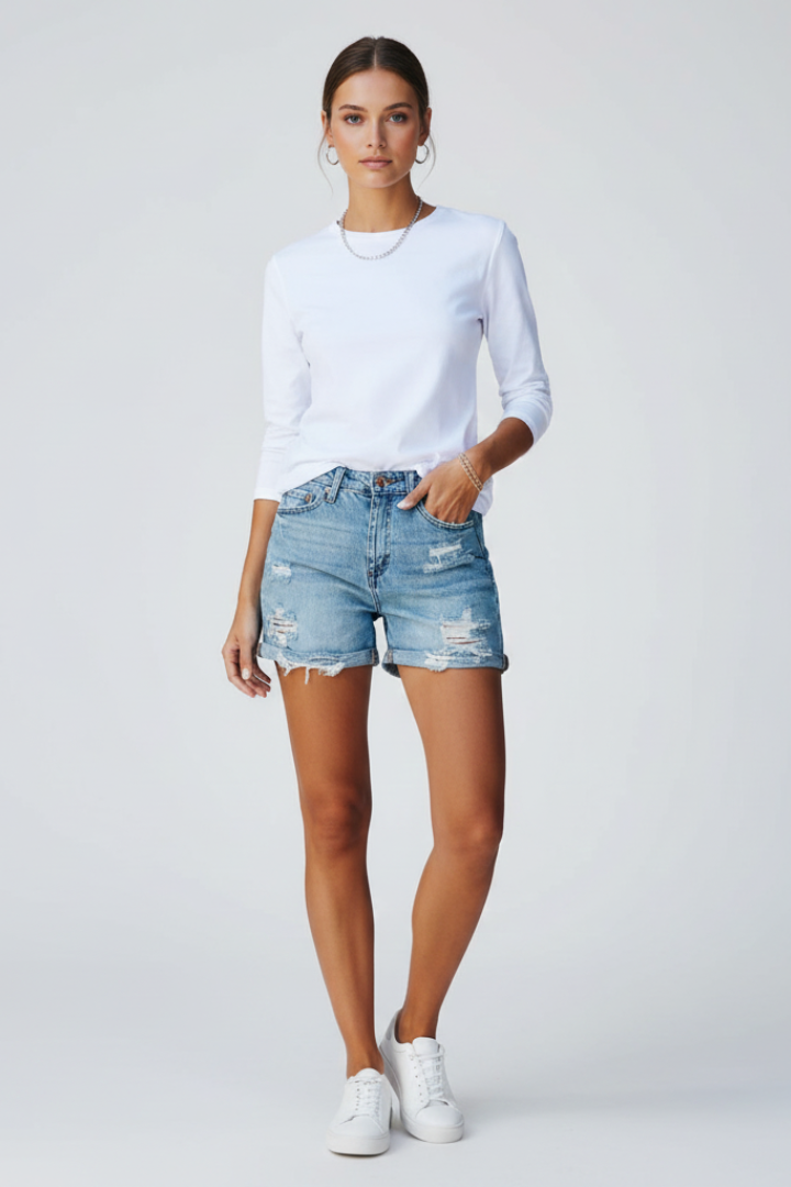 Natalie Forsbrook | High-Rise Distressed Denim Shorts in Light Blue