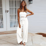 Allegra Vossbourne | Strapless Tie Waist Wide Leg Jumpsuit in Beige