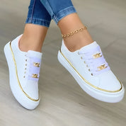 Genevra Whitmore | White Platform Sneakers with Gold Chain Detail