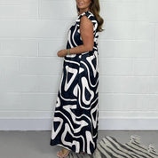 Theodine Valbright | Abstract Print Wide-Leg Jumpsuit with Ruffle Cap Sleeves