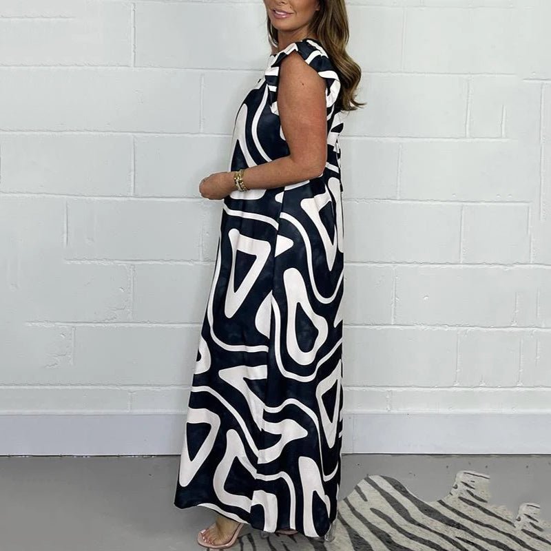 Theodine Valbright | Abstract Print Wide-Leg Jumpsuit with Ruffle Cap Sleeves